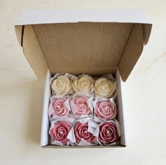 Macro close-up shot highlighting the intricate, realistic petal carvings and elegant pink color shading of the artisanal rose wax melts