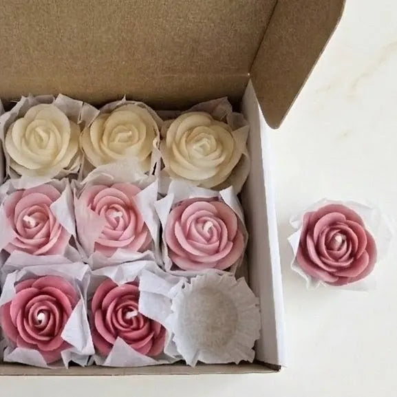 The rose flower style wax melts box styled elegantly on a modern coffee table setup as a minimal, pink aesthetic home decor accent