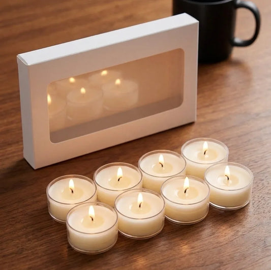 An 8-count arrangement of aesthetic white round tealight candles styled on a heat-resistant tray for luxury home decor gifting