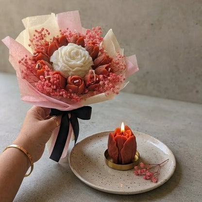 A lit white peach floral bouquet candle burning cleanly on a protective tray, releasing a refreshing fruit-infused aroma into the room