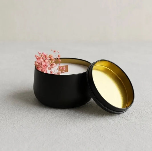 A clear perspective scale shot displaying the exact dimensions of the handcrafted black travel tin candle with dried flowers