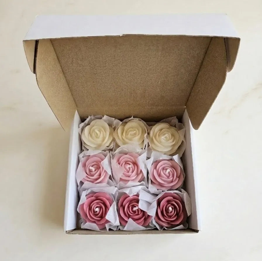 Macro close-up shot highlighting the intricate, realistic petal carvings and elegant pink color shading of the artisanal rose wax melts