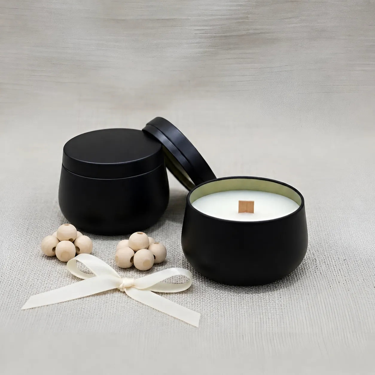 Handmade black tin scented candle infused with premium oud fragrance and clean-burning coconut soy wax