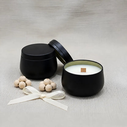 Handmade black tin scented candle infused with premium oud fragrance and clean-burning coconut soy wax
