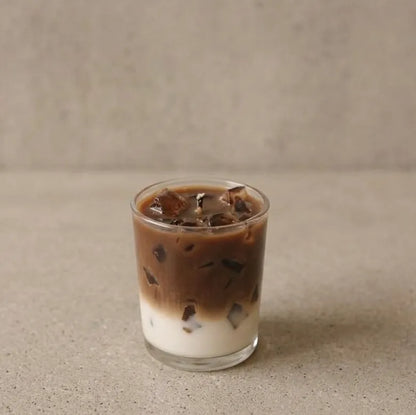 Handcrafted iced coffee latte scented jar candle made with premium soy wax, featuring a clean minimalist label design for aesthetic home decor