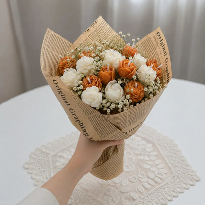 Luxury peach and white flower bouquet candle with elegant fragrance, handcrafted using soy wax.