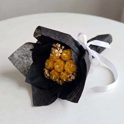 The yellow mini bouquet candle styled beautifully as a bright, minimal decor accent piece on a modern coffee table setup