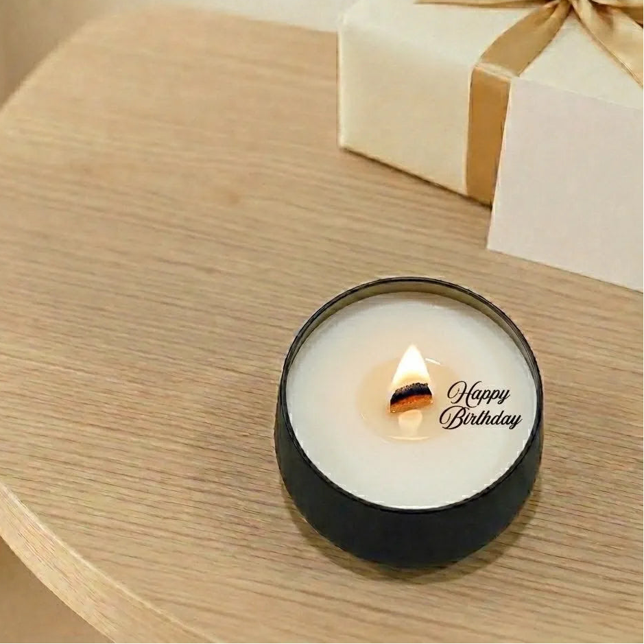 Secret reveal scented jar candle in a black tin, made with natural coconut soy wax and premium oud fragrance
